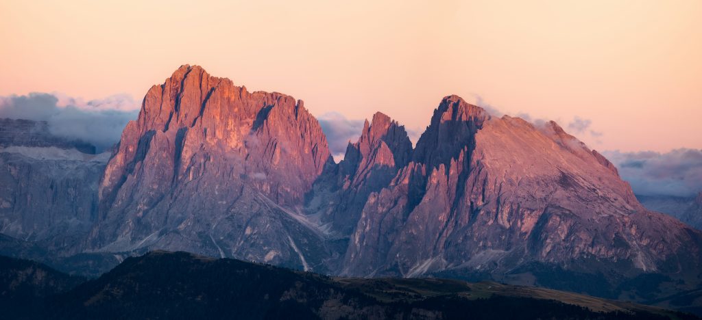 The rocky peaks of Langkofel glowing pink in the evening light
